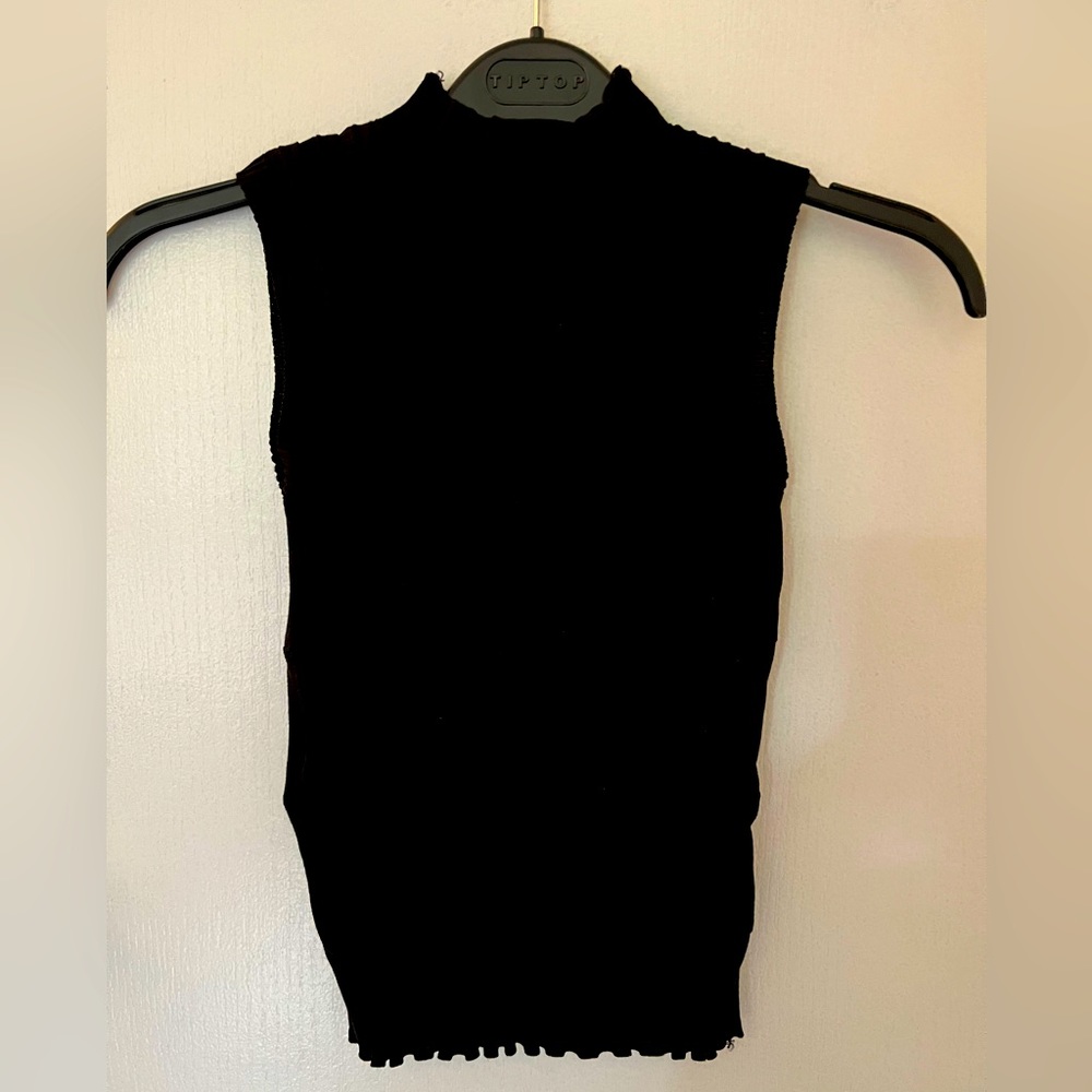 Black vest high neck. Very stretchy. XS/S size